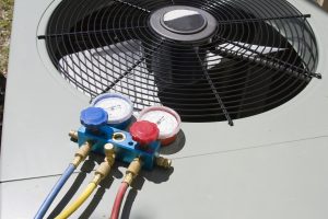 AC condenser with tools on it
